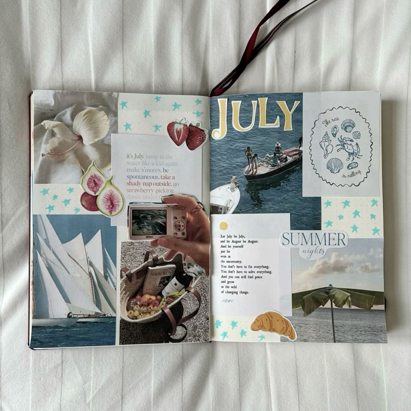 Creative journaling for beginners summer collage spread—open notebook with July gluebook layout using ocean photos, vintage ephemera, labels, and washi tape.