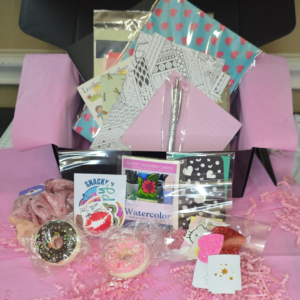 Mini Junk Journal Starter Bundle A6 flatlay showing journal, papers, stickers, and ephemera