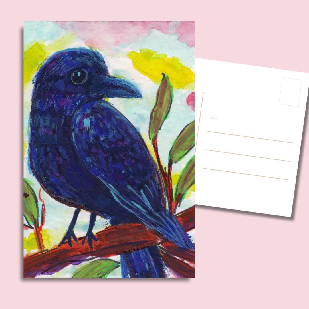 whimsical bird postcards showing a deep blue raven against light sky and foliage